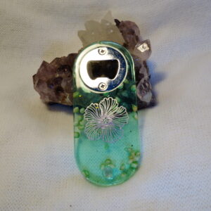 DECAPSULEUR VERT FLEUR HOLOGRAPHIQUE ET COQUILLAGES FORME ARRONDIE