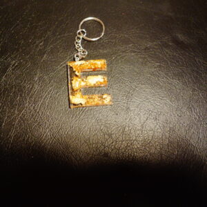 LETTRE E PORTE CLEF PAILLETTE OR ET CUIVRE
